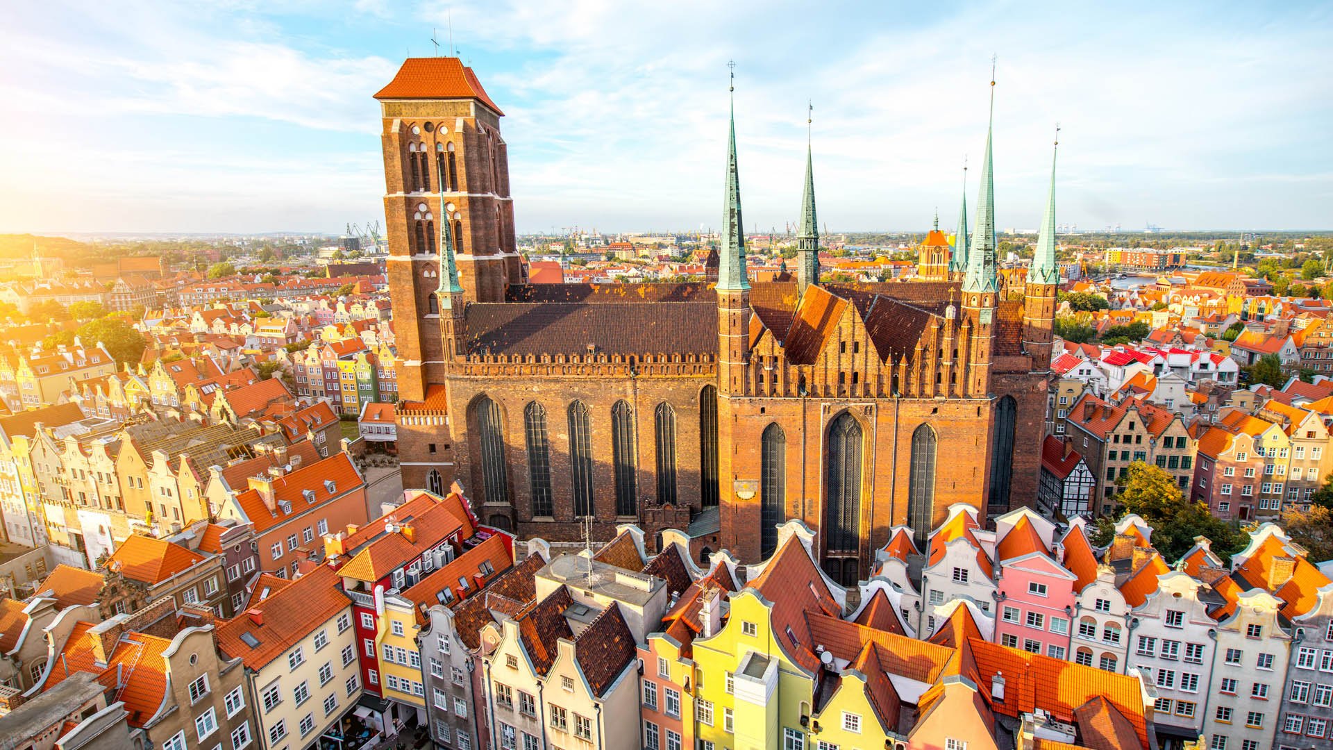 Cityscape aerial view on the old town with saint Marys church on the sunset in Gdansk, Poland