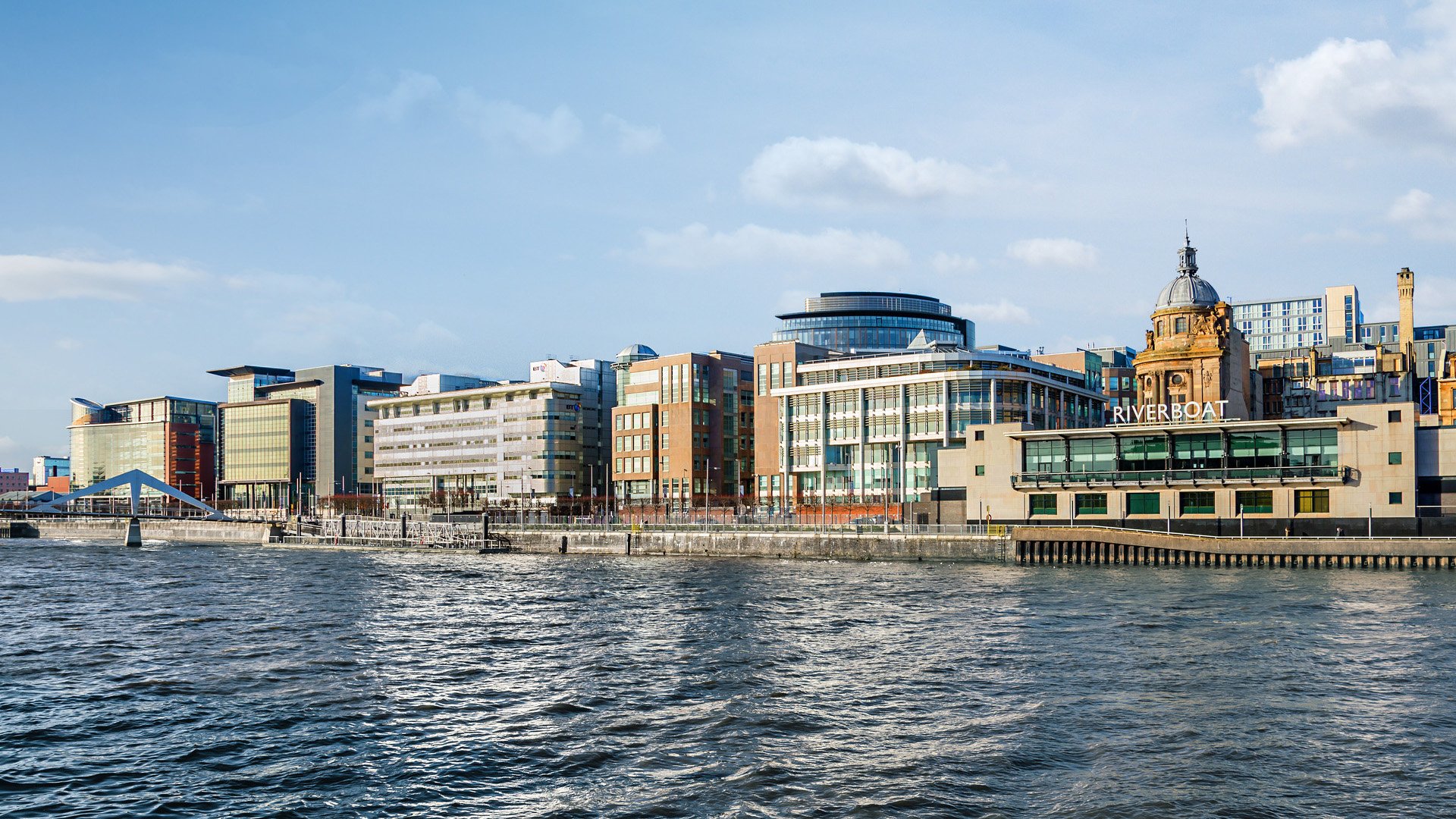 GLASGOW, SCOTLAND – MARCH 08: Modern office buildings on banks of the River Clyde at Atlantic Quay on March 08, 2015 in Glasgow, Scotland.
