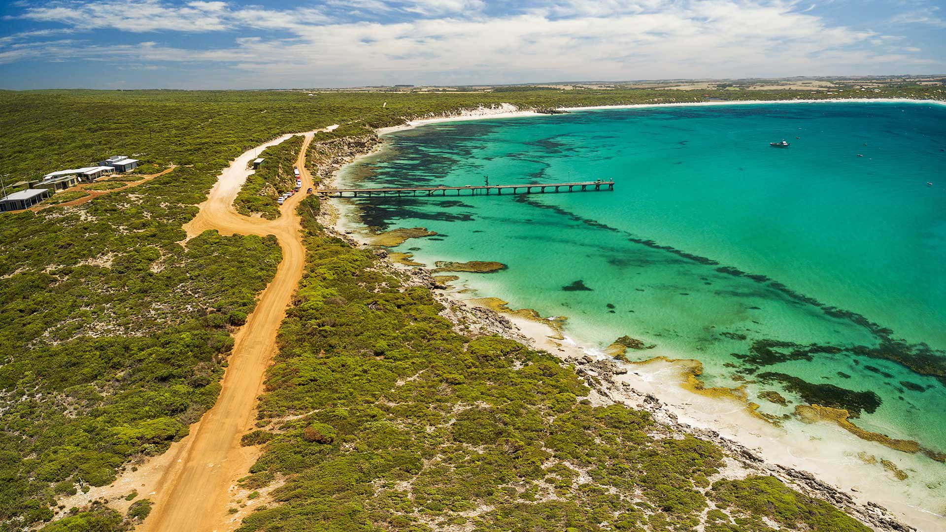 Aerial view of Vivonne Bay pier and vivid turquoise ocean water, Kangaroo Island, South Australia