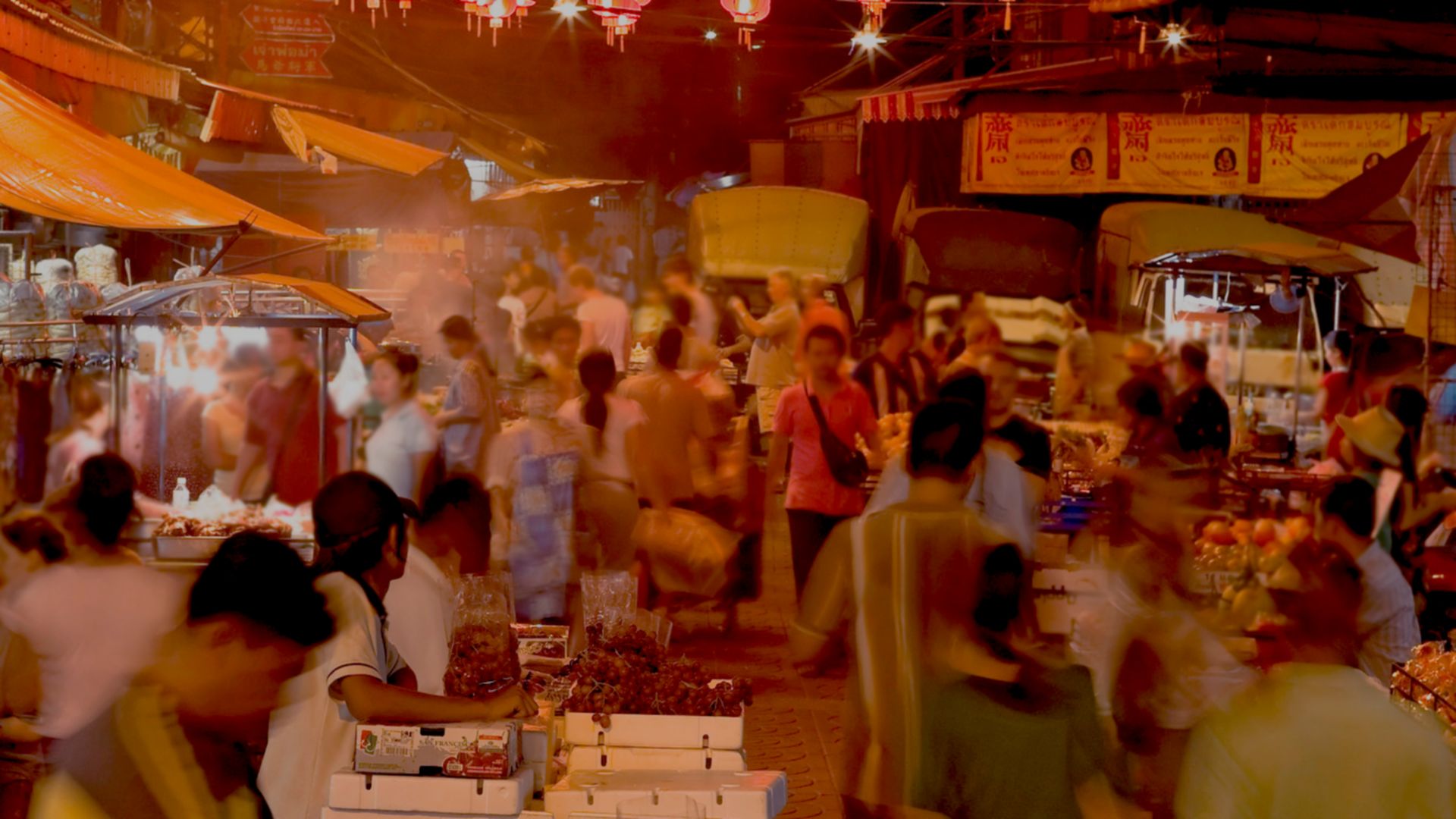 Chinese New Year. food - night Market, with lanterns, decorated street, crowds of people.