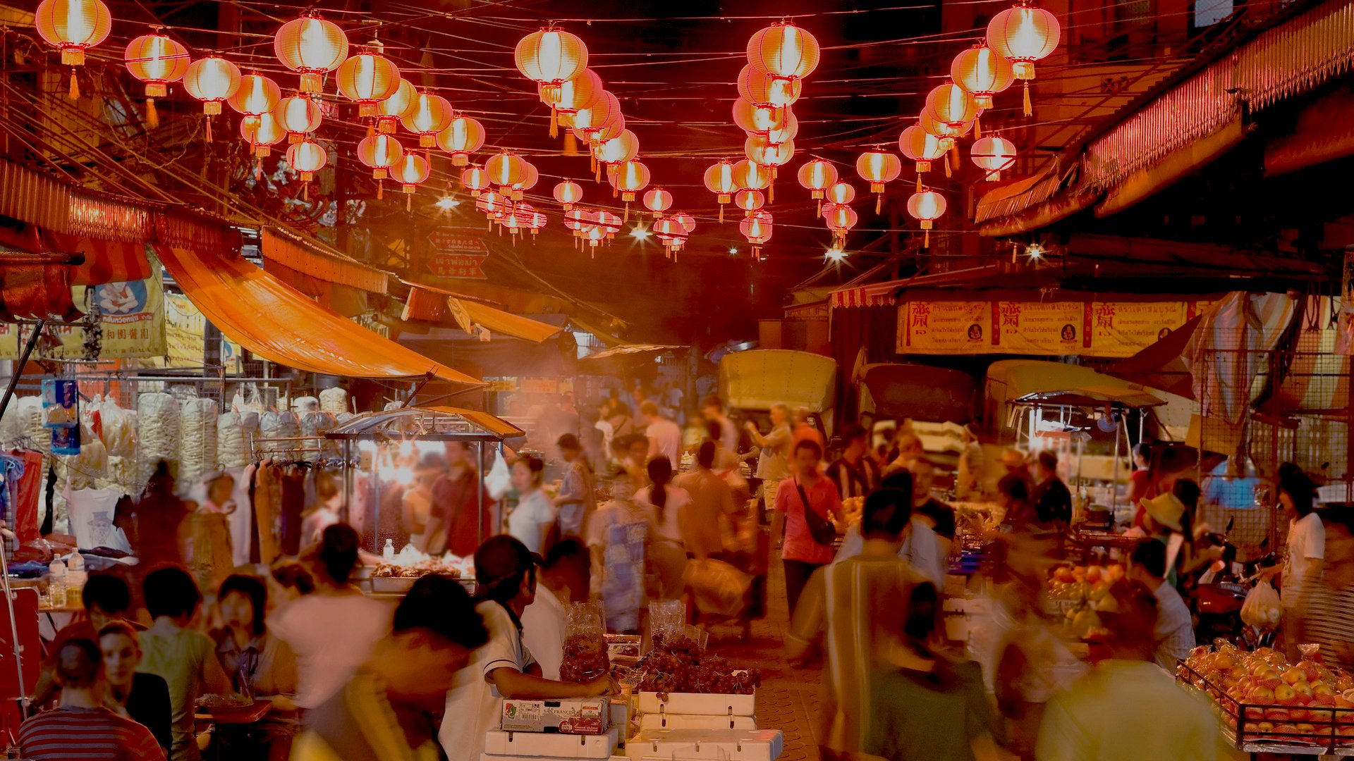 Chinese New Year. food - night Market, with lanterns, decorated street, crowds of people.