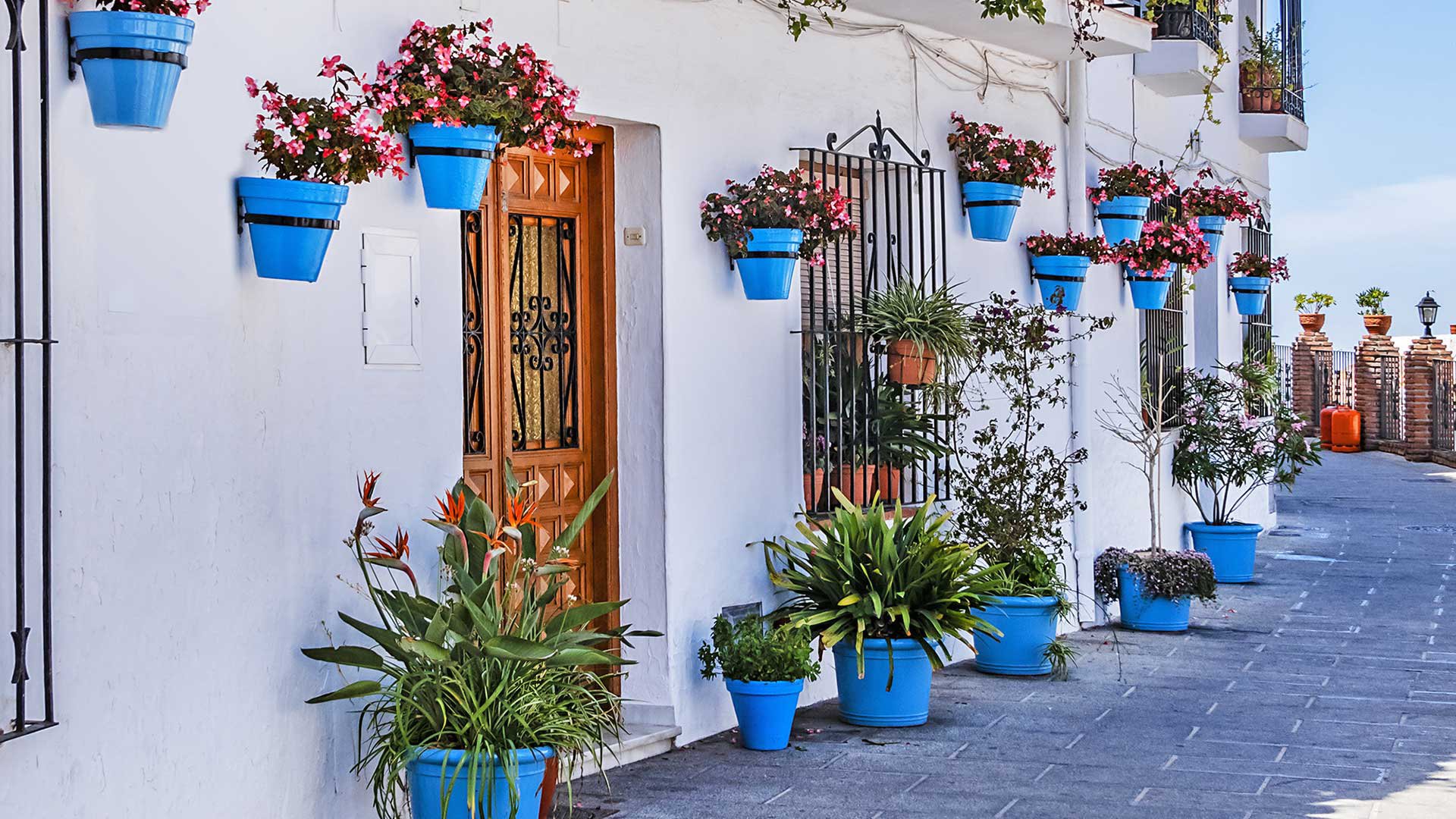 Beautiful view of old Mijas Calle Moro (Moro Street). Mijas (not far from Malaga) - Spanish hill town overlooking the Costa del Sol, known for its white-washed buildings. Mijas, Andalusia, Spain.