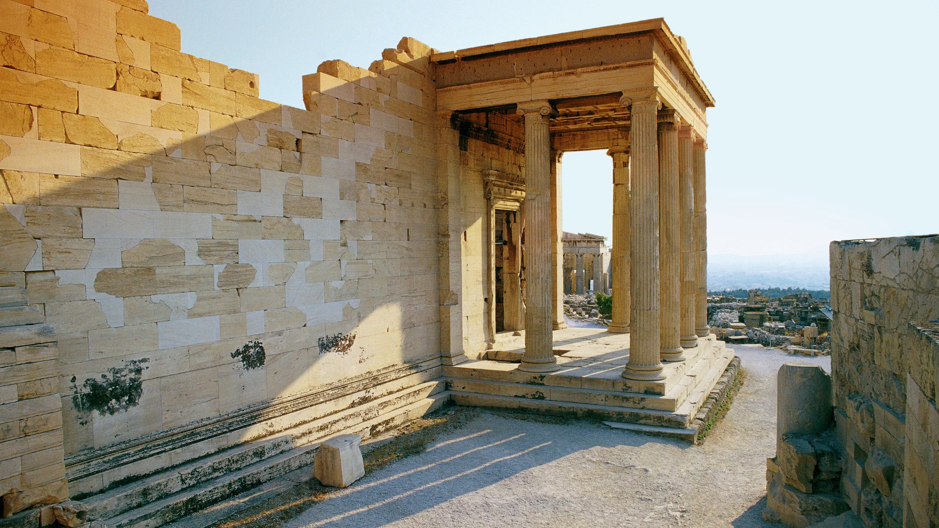 ca. 2002, Athens, Greece --- Tourist Strolling around Acropolis Restoration --- Image by © Royalty-Free/Corbis