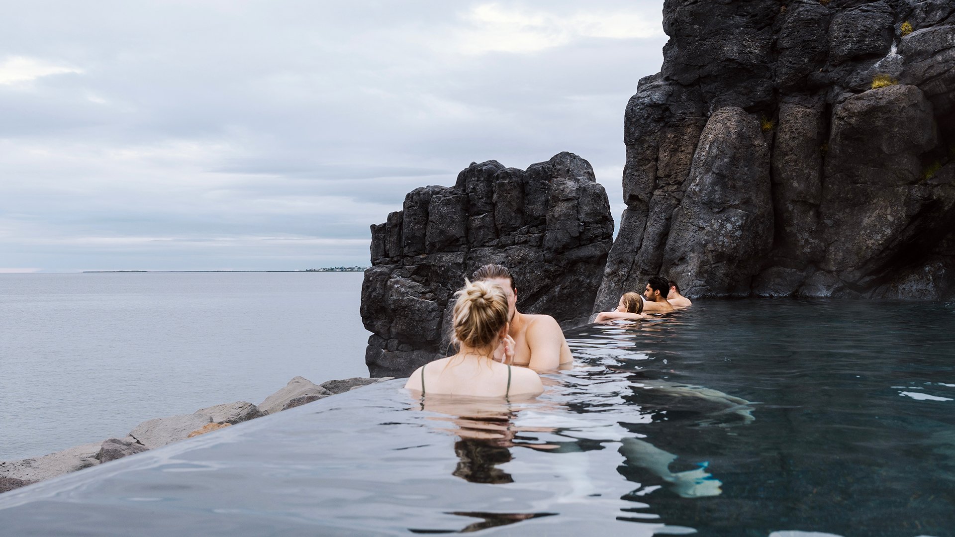 Reykjavik, Iceland - July 17 2022: Sky Lagoon in Iceland. Tourists enjoying geothermal spa with heated water during cold day; Shutterstock ID 2263275121; purchase_order: BB23-27693 at; job: ; client: AIDA Cruises; other: 