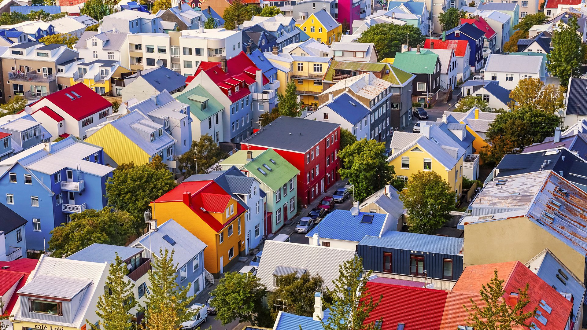 Colorful Red Green Blue Yellow Houses Cars Streets Reykjavik Iceland.  Most houses are made of corrugated metal.