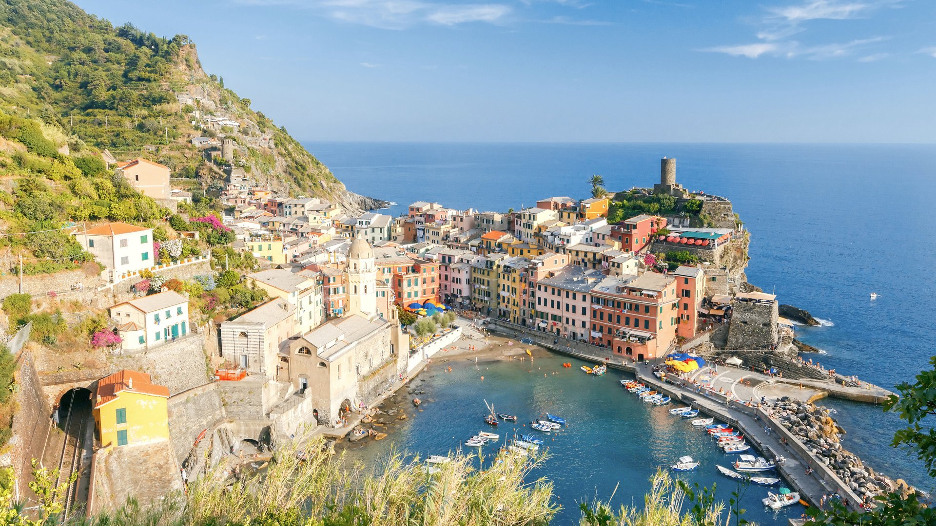 The view from the high hill village of Vernazza and the old harbor at sunset. Cinque Terre National Park. Liguria. Italy.