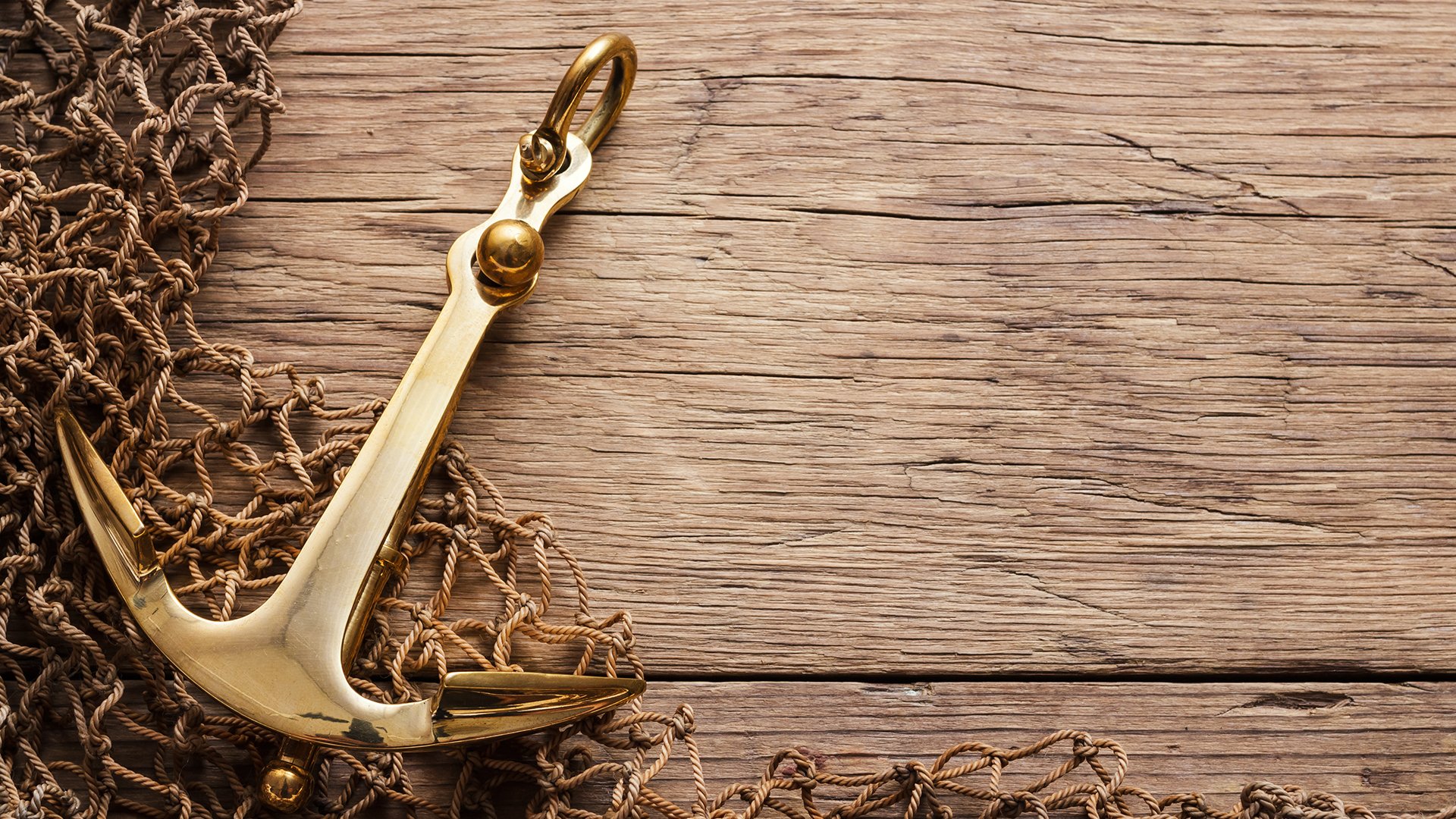 Anchor on wood background