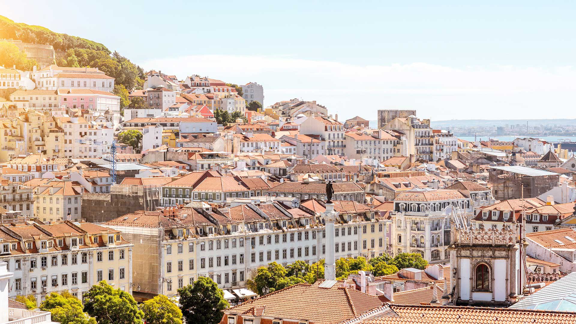 Cityscape view on the old town with Pedro IV statue in Lisbon city, Portugal