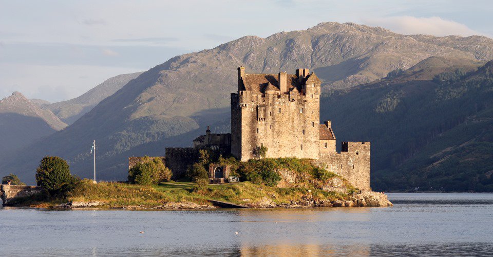 Eilean Donan castle, in the Scottish Highlands, seen at dusk.