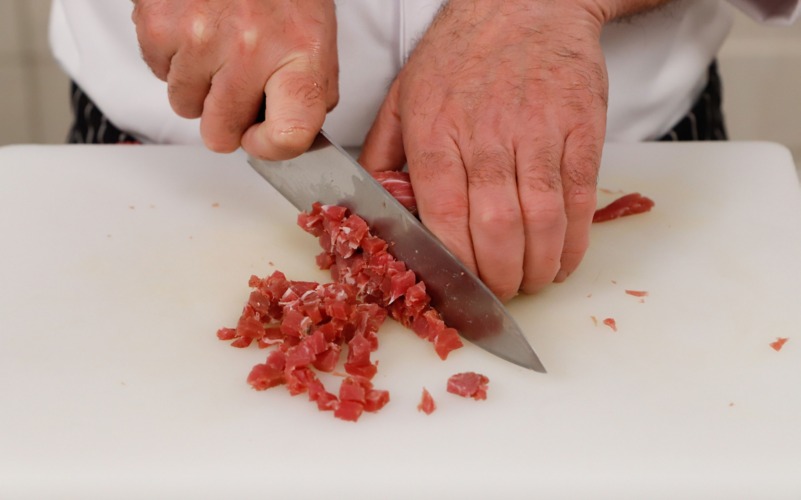 tagliare il prosciutto