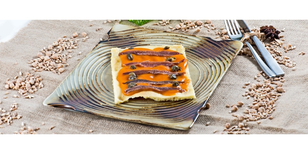  Focaccia con crema di zucca, alici e capperi