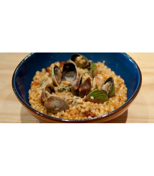 Fregola risottata con tartufi di mare vongole e fumetto di scorfano