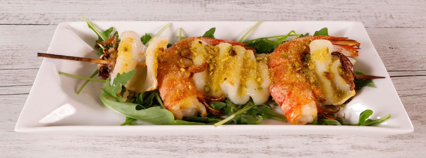 Spiedini di pesce al forno alle erbe