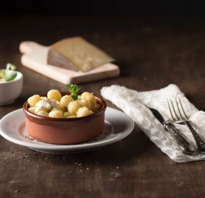 Gnocchi di farina gialla mais marano, speck e stravecchio gratinati alt