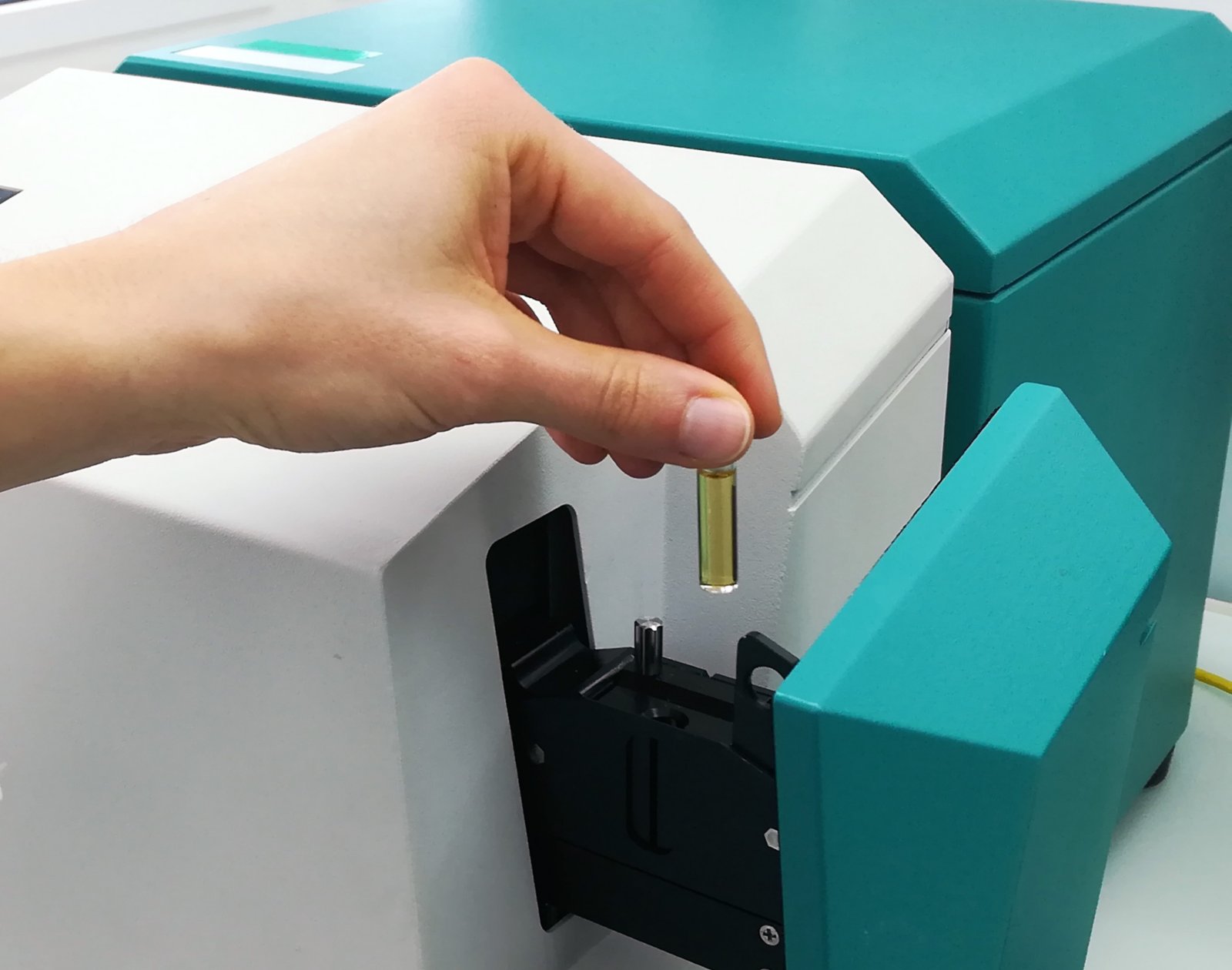 XDS RapidLiquid Analyzer and 8 mm disposable vial filled with a gasoline sample.