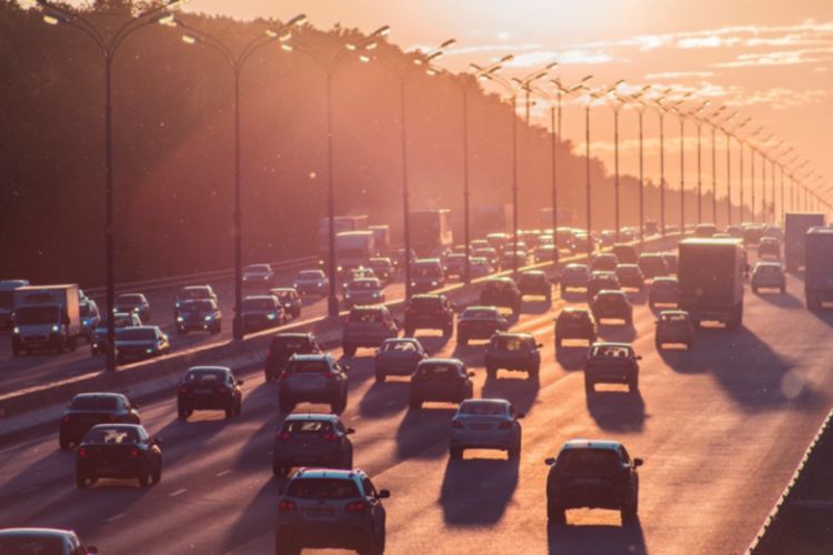 Vehicles traveling on a busy highway.