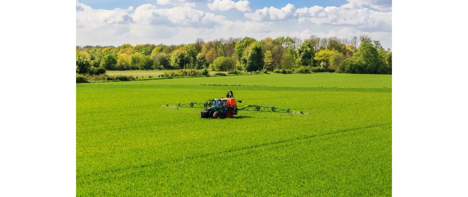 Tractor in a field spraying herbicides, glyphosate and AMPA